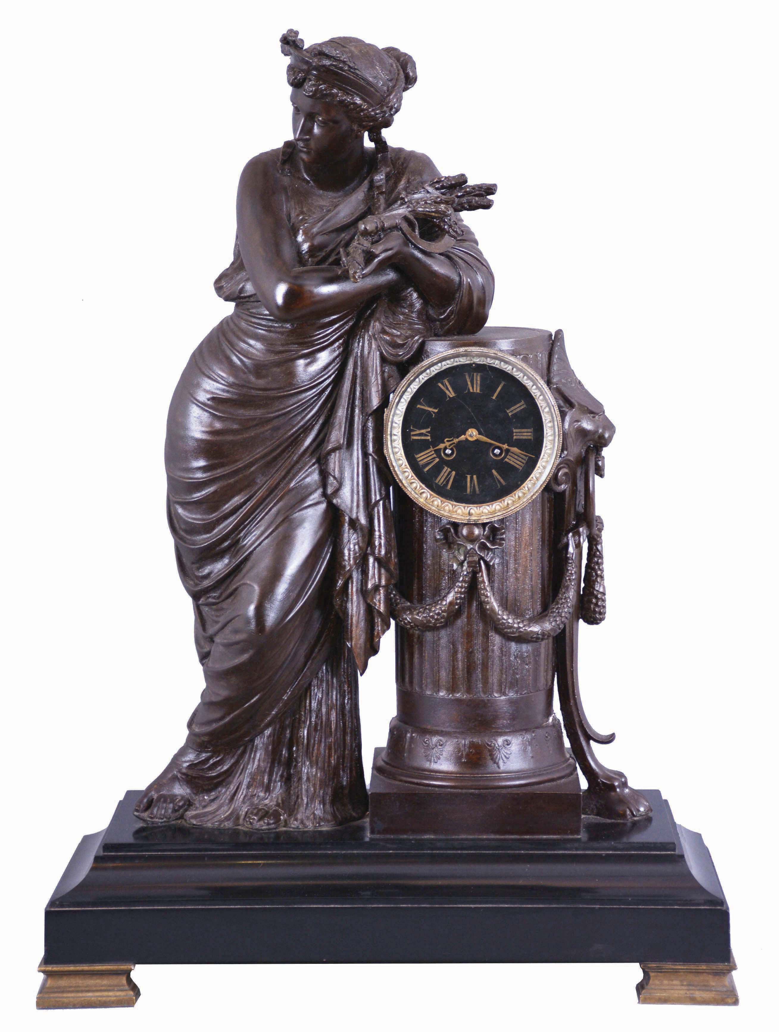 France, extra large patinated spelter figural clock, depicting a tall woman in classic Greek gown, (figure is 25"), standing beside a fluted pedestal with footed accents, and with a good bell strike movement. — Antique Clocks Price Guide