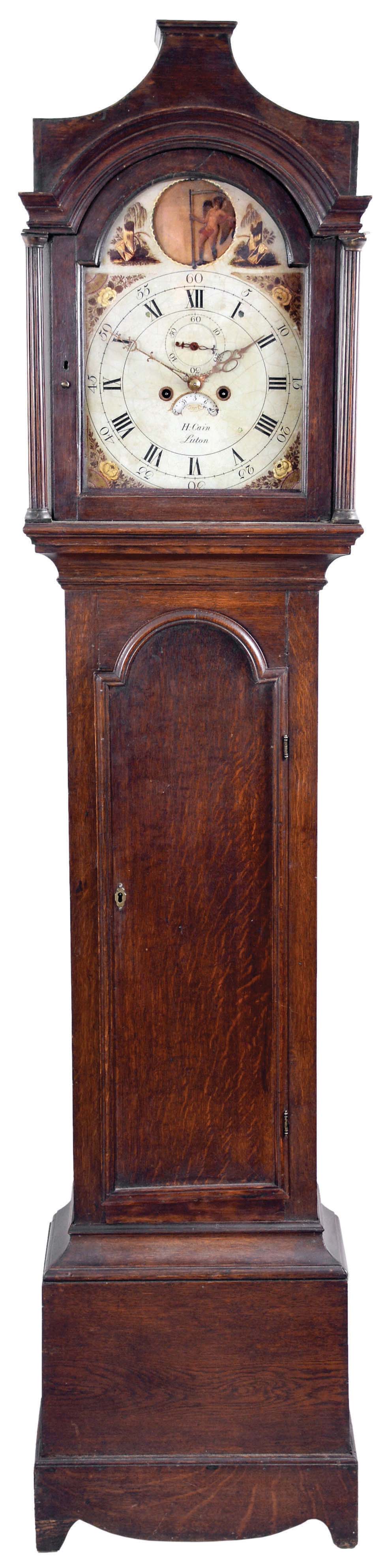 H. Cain, Luton, England, tall clock, 8 day, time, strike and calendar, weight driven movement pagoda top oak case with painted metal dial, painted spandrels and rocking Father Time — Antique Clocks Price Guide