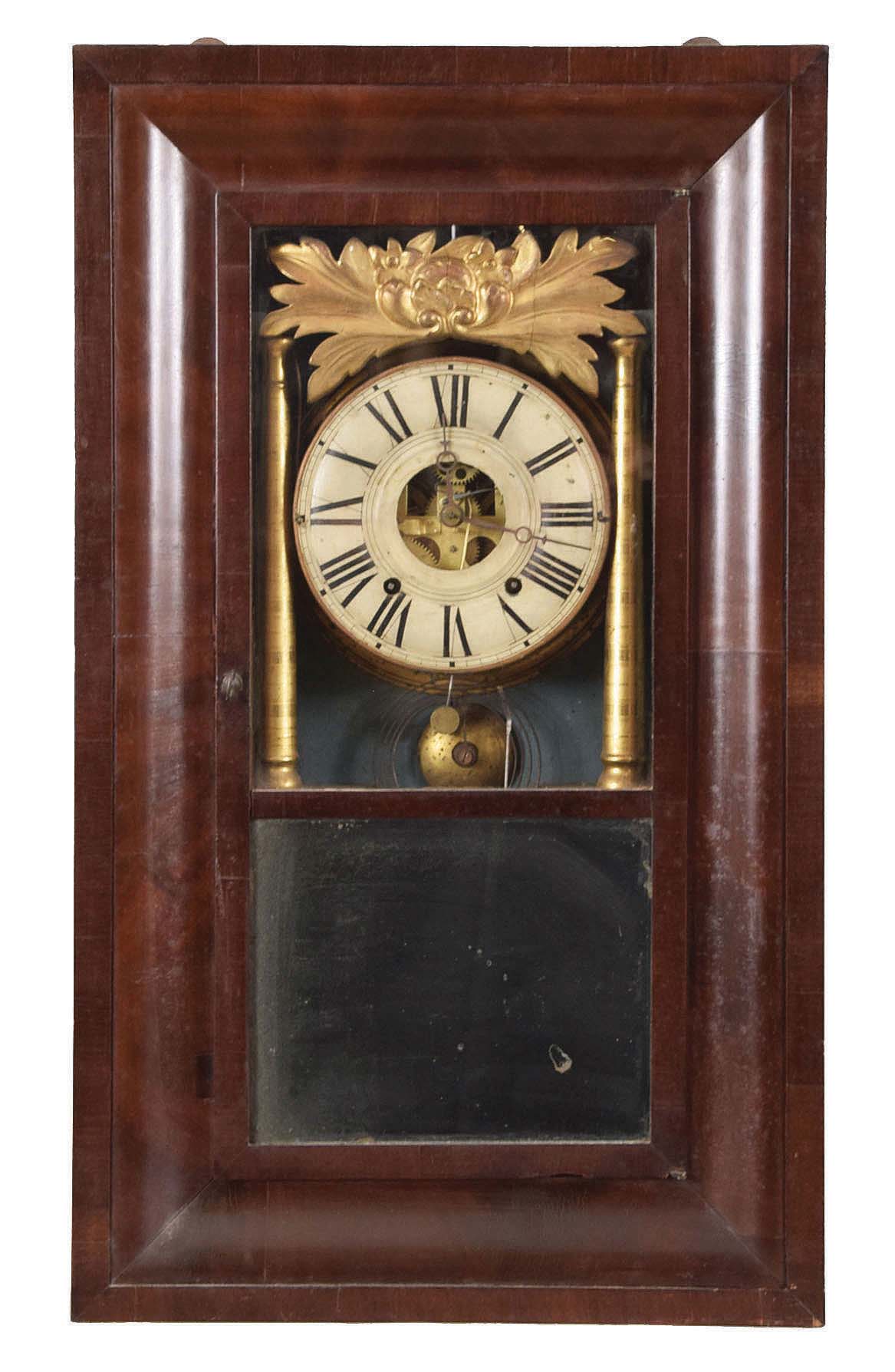 Joseph Ives, Plainville, Conn., 8 day, time and strike, weight brass movement O.G, gilt columns and gilt leaf crest shelf clock. This case has the earlier version of the movement as it has a partial cast iron backplate. The later version made by Hills, Goodrich & Co had full cast iron backplate. — Antique Clocks Price Guide
