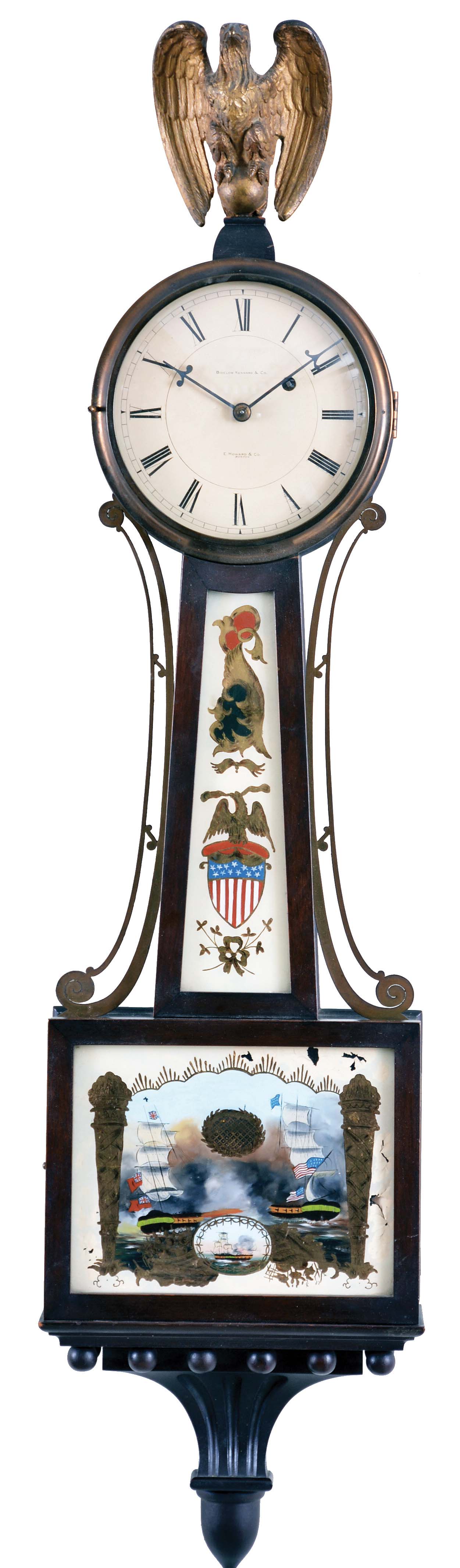 E. Howard & Co., Boston, Mass., for Bigelow Kennard & Co., Banjo Clock, with brass eagle finial surmounting the zinc roman numeral dial inscribed "E. Howard & Co./Boston" and "Bigelow Kennard & Co.", brass glazed bezel, flat frames housing the glasses, the lower glass depicting a British and American warship in battle during the War of 1812 both flying their national flags, cross-hatched oval for pendulum viewing, the waist glass flanked by brass side ornaments and showing a Federal shield and an American patriotic eagle, all resting on a carved pedestal, eight day nickel plate time only movement with front plate inscribed "E. Howard & Co./Boston", maintaining power, Geneva stop (now gone), viewing port for the recoil escapement all powered by a lead weight and regulated by a flat wooden rod and brass faced pendulum bob, — Antique Clocks Price Guide
