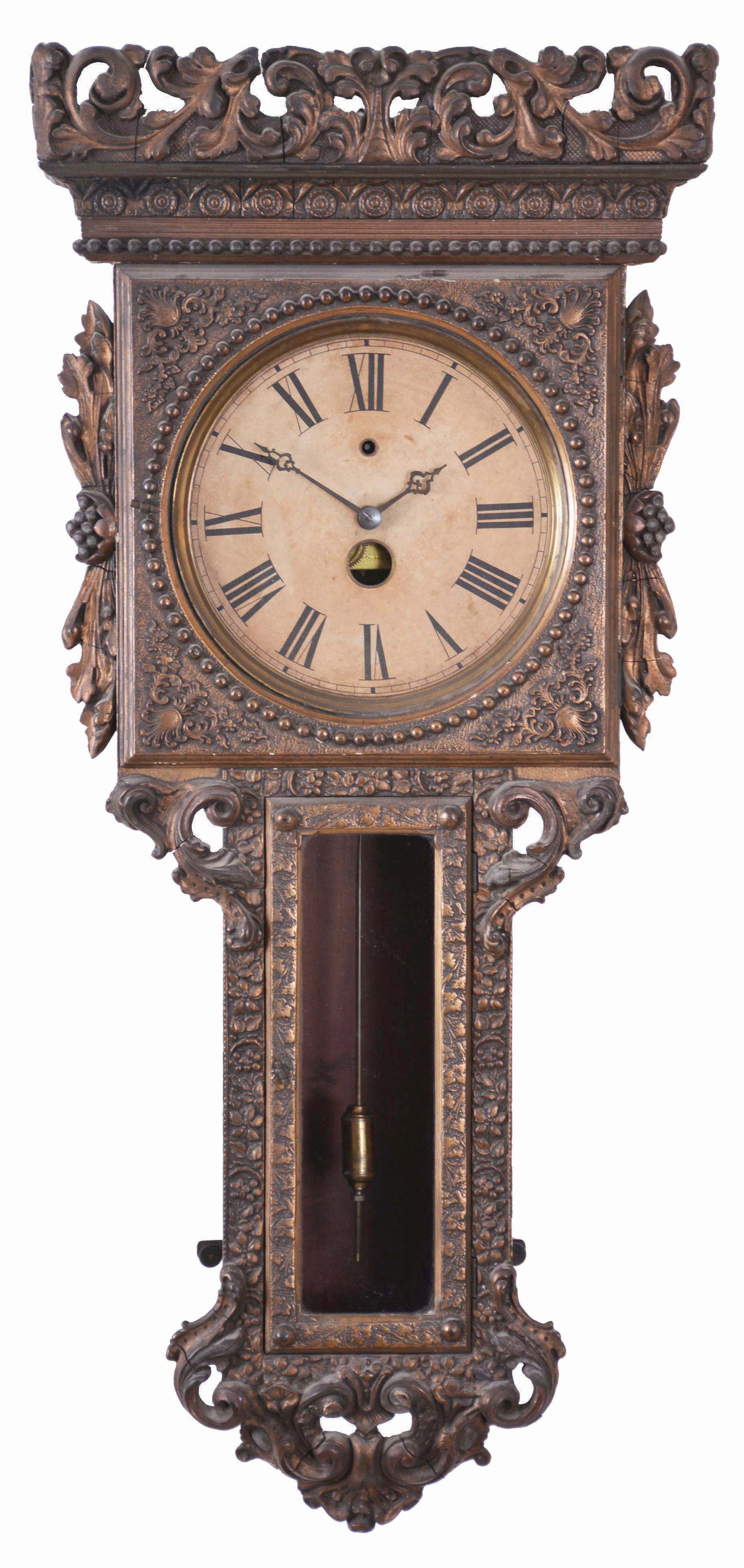 Votti and Newman, Philadelphia, rare wall clock with metallic painted finish over extensive gesso trim, and with rare front to back pendulum, and the patent date visible through the dial opening Jan 11, 1884. Note winding below 12. We could not calculate the running duration, although Votti made movements of week, month and year duration. We ESTIMATE that this is a one month clock. — Antique Clocks Price Guide