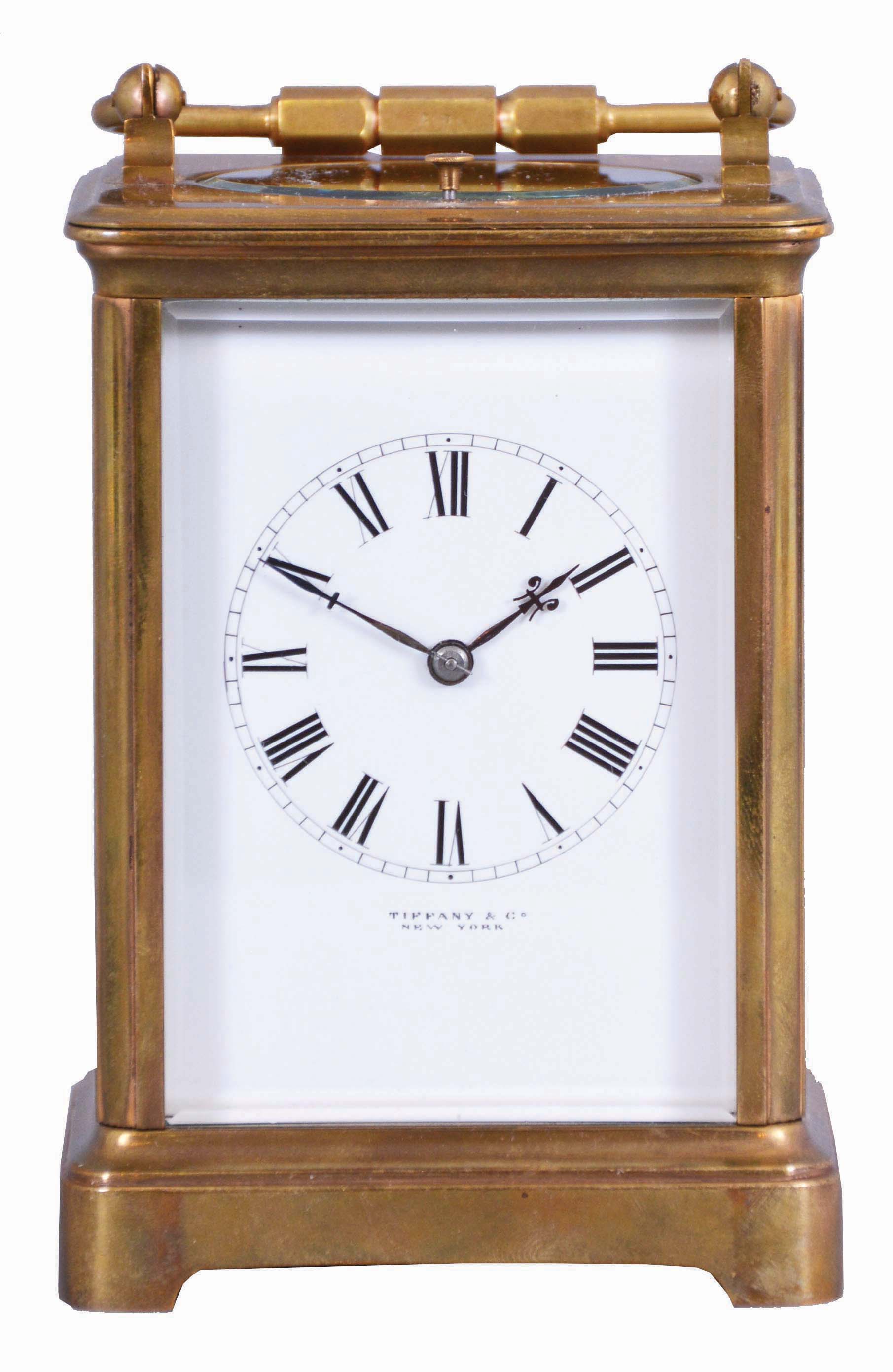 France, for Tiffany & Co., New York, a rare five minute repeating carriage clock, glazed Corniche case, signed Roman numeral white enamel dial, blued steel hands, 8 day, time and strike movement with lever platform and cut bimetallic balance, counting the hours in passing, and repeating the last hour and five minute interval on demand, together with its leather covered wooden travel case — Antique Clocks Price Guide