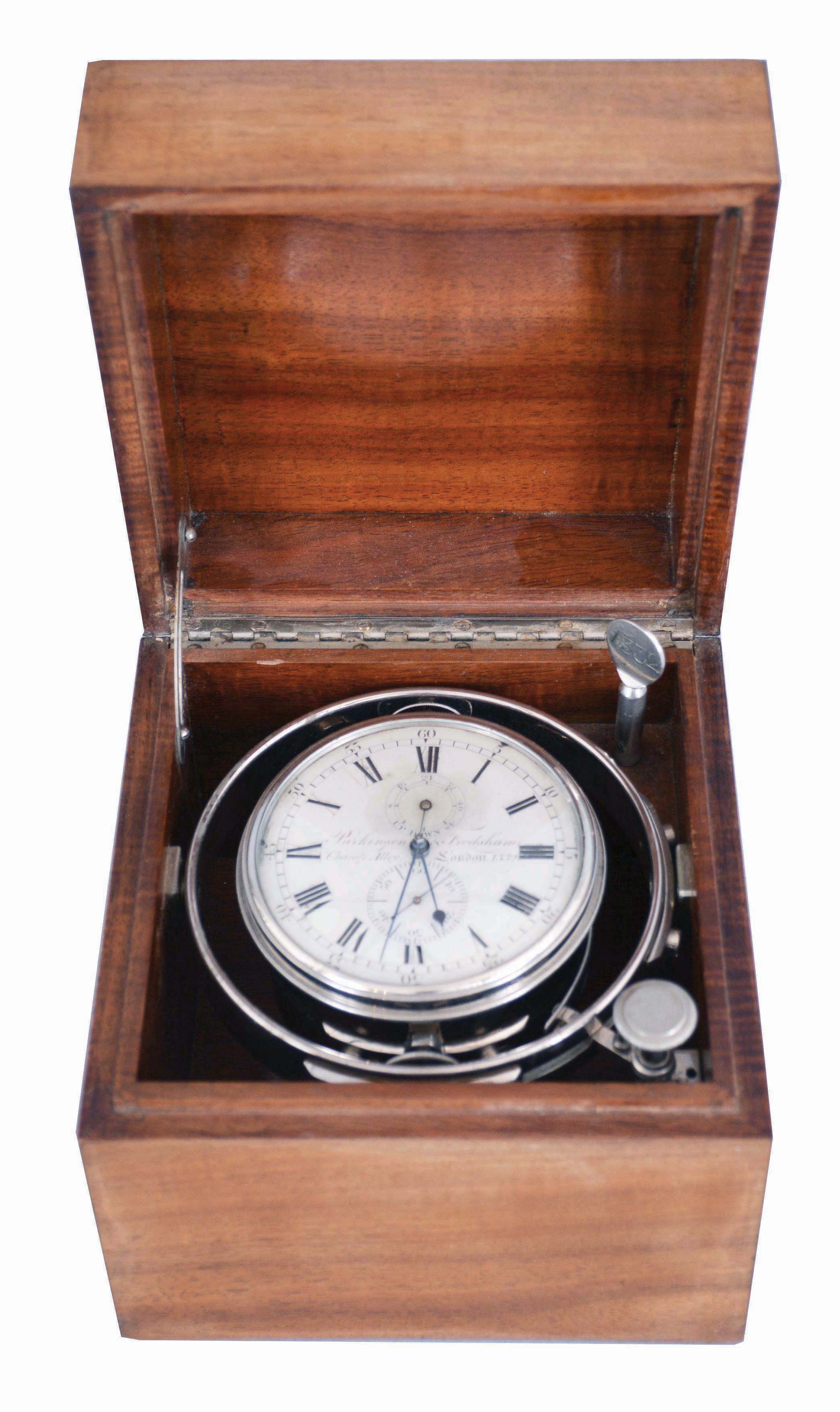 Parkinson & Frodsham, Change Alley, London, an early 19th century two day marine chronometer with later box, 11 jewel, free sprung fusee movement with Earnshaw's spring detent, the cut bimetallic chronometer balance with blued, helical spring, and diamond endstone, Roman numeral silvered dial with wind indicator, blued steel spade and poker hands, contained in a shock mounted, nickel plated bowl, with nickel plated gimbals and original key, serial #1332, mounted in a later, purpose made, polished curly mahogany box — Antique Clocks Price Guide