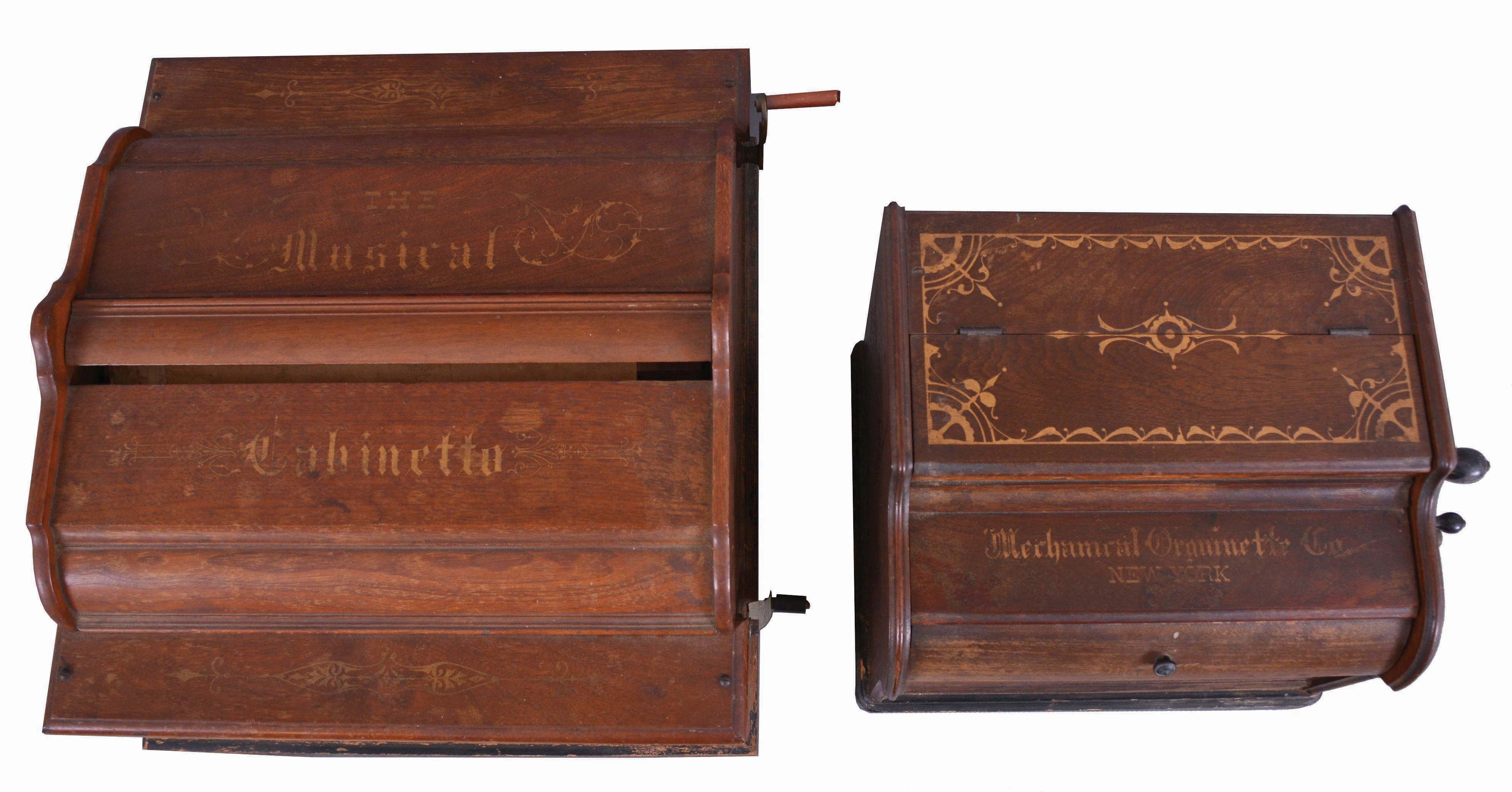 American mechanical organettes- 2 (Two): (1) "The Mechanical Cabinetto", plays large 14 inch wide paper rolls, in a walnut case with gold stenciling; (2) " The Musette", and made by the Mechanical Organette Co., of Newark, NJ, this unit playing small paper rolls that are 3 1/2 inches wide with narrow perforations. — Antique Clocks Price Guide