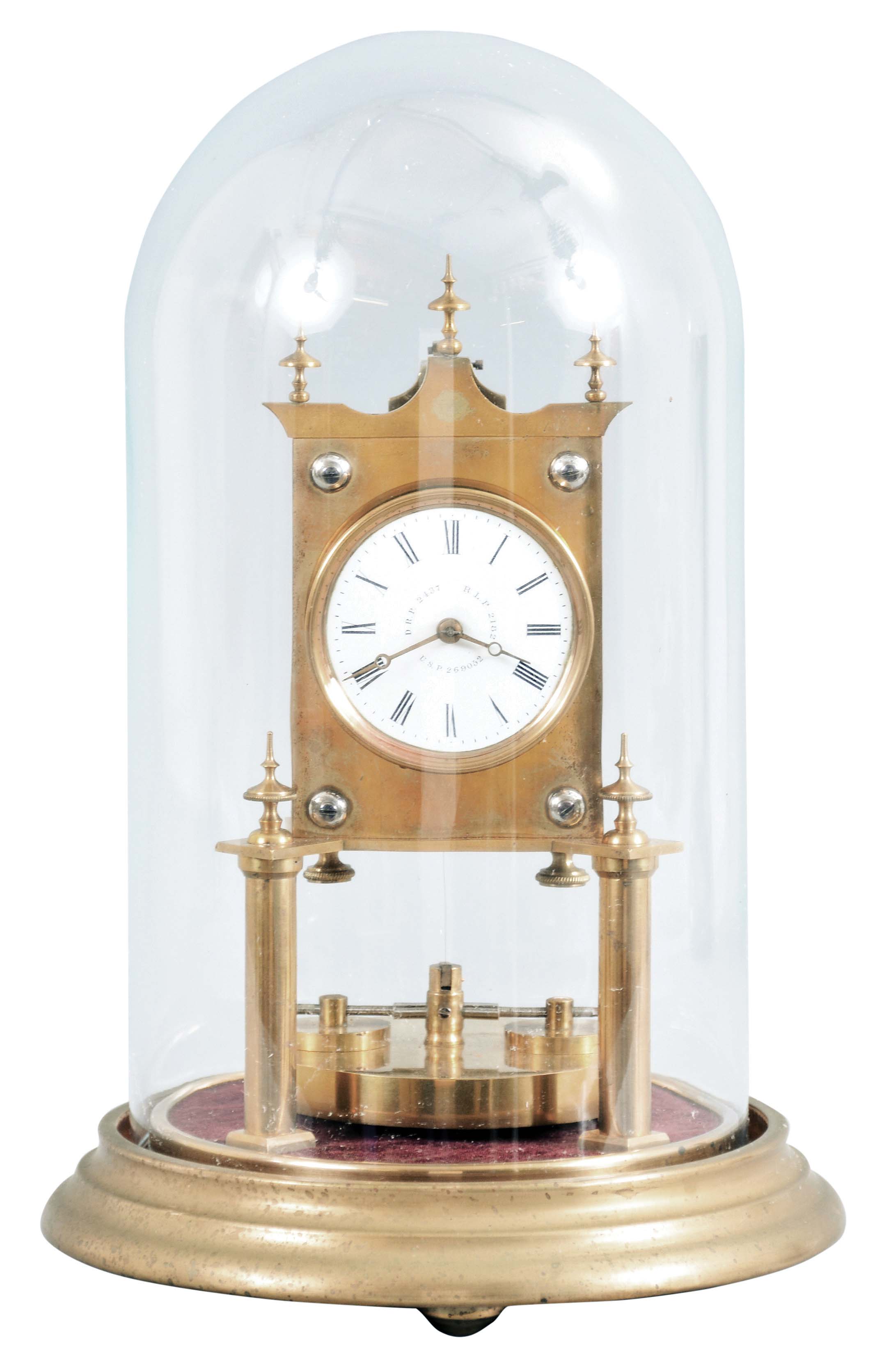 Gerson Wintermantel and Cie., Triberg, Germany, 400 day anniversary clock, spring driven, torsion pendulum movement with disc pendulum in a polished brass case with white enamel dial under dome. — Antique Clocks Price Guide