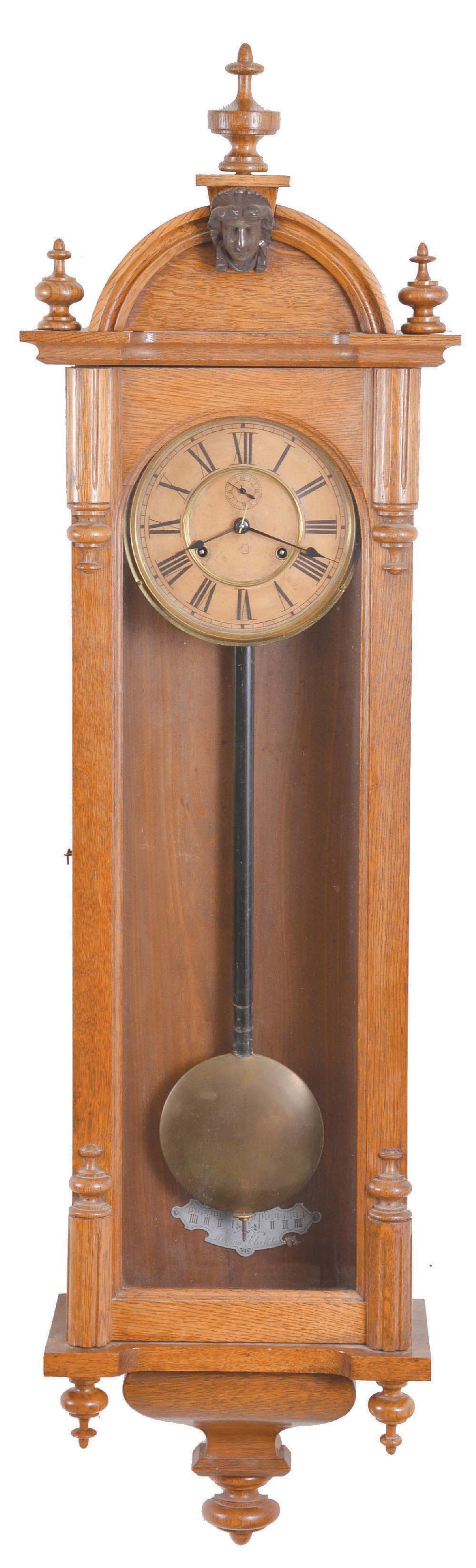 Ansonia Clock Co., New York, "Capitol" model wall timepiece, 8- day double spring movement with seconds bit below 12, in an oak case. — Antique Clocks Price Guide