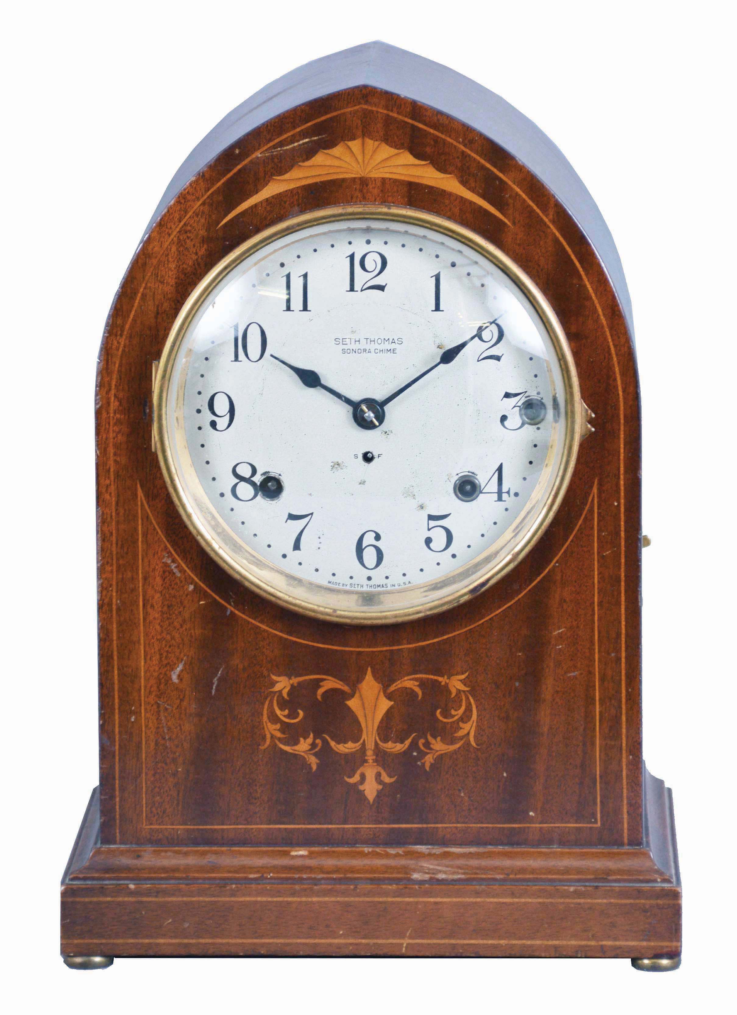 Seth Thomas Clock Co., Thomaston, Conn., "Chime Clock No. 64" shelf clock with a spring driven, 8 day time and 5 Bell Sonora strike movement in a mahogany case with decorative inlay. — Antique Clocks Price Guide