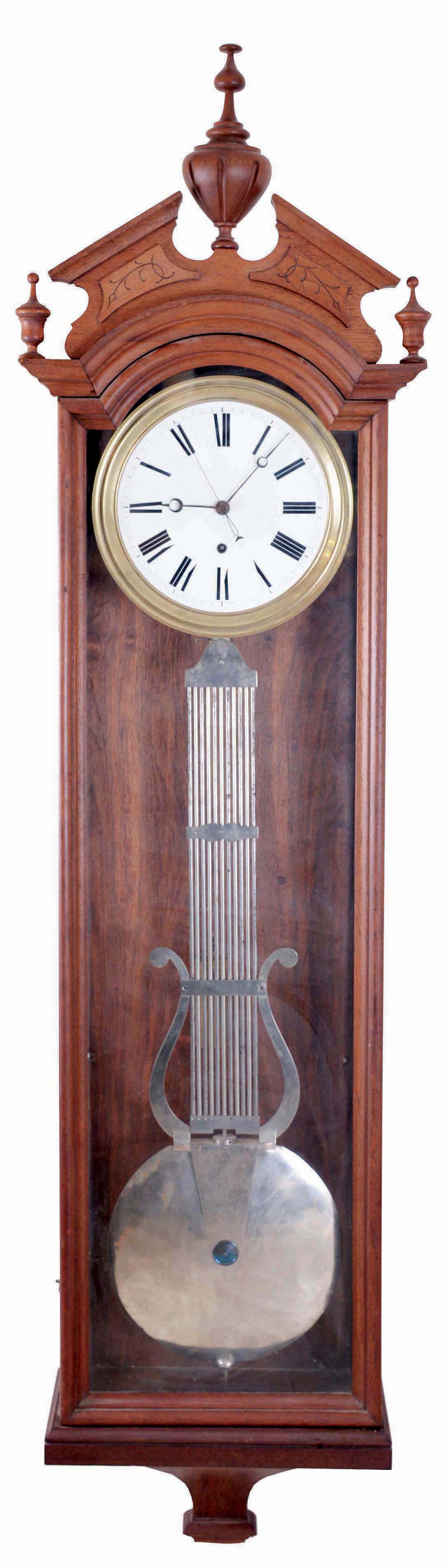 Ansonia Clock Co., New York, "Regulator No. 4", jeweler's regulator wall clock, 8 day, time only, brass weight driven Swiss movement with pinwheel escapement, gridiron lyre pendulum and sweep seconds in a walnut case with a white enamel dial and moon hands — Antique Clocks Price Guide