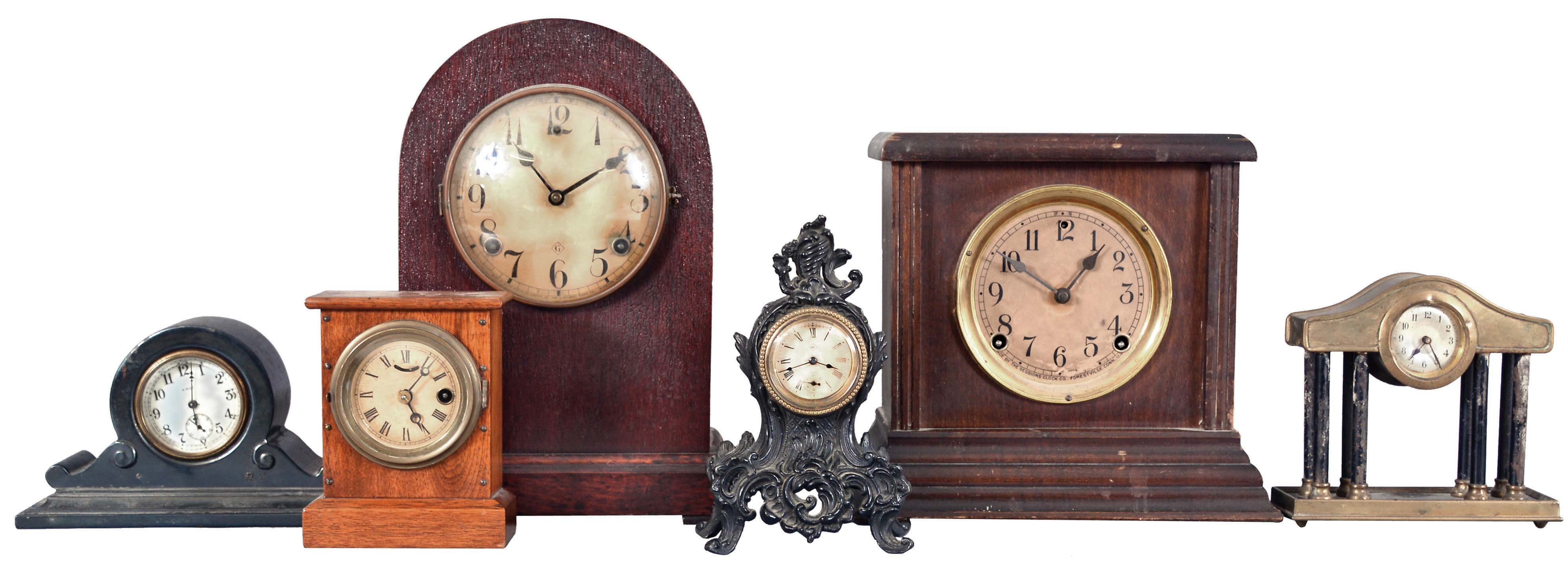 Clocks- 10 (Ten) Mantel and Desk: Clocks include four black mantel clocks by Sessions, Waterbury, and Seth Thomas; flat and round top time and strike mantel clocks by Sessions and Gilbert; three metal and one wood case time only desk clocks. — Antique Clocks Price Guide