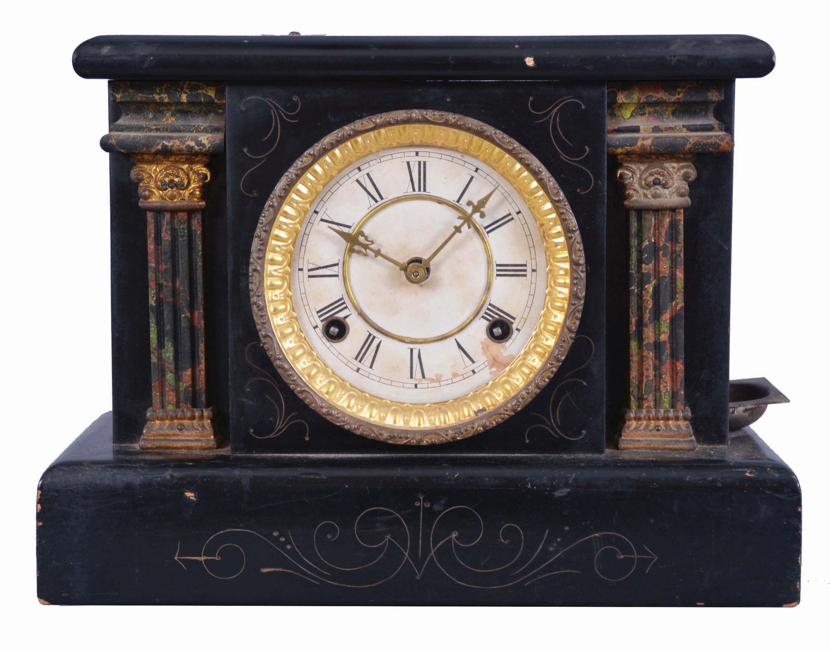 Loheide MFG. Co., St. Louis, Mo., "Automatic Sales Machine" clock and trade stimulator (often called a gambling clock). 8 day, time and token dispenser, spring driven in a black enameled wood case. The clock has a coin slot at the top. When a nickel was deposited, it triggered the strike train of the clock which drives a token dispensing system. A modified countwheel will dispense one, two, and on rare occasion, three tokens in the tray mounted to the side of the clock. Tokens were then exchanged for small items at the retail location. — Antique Clocks Price Guide