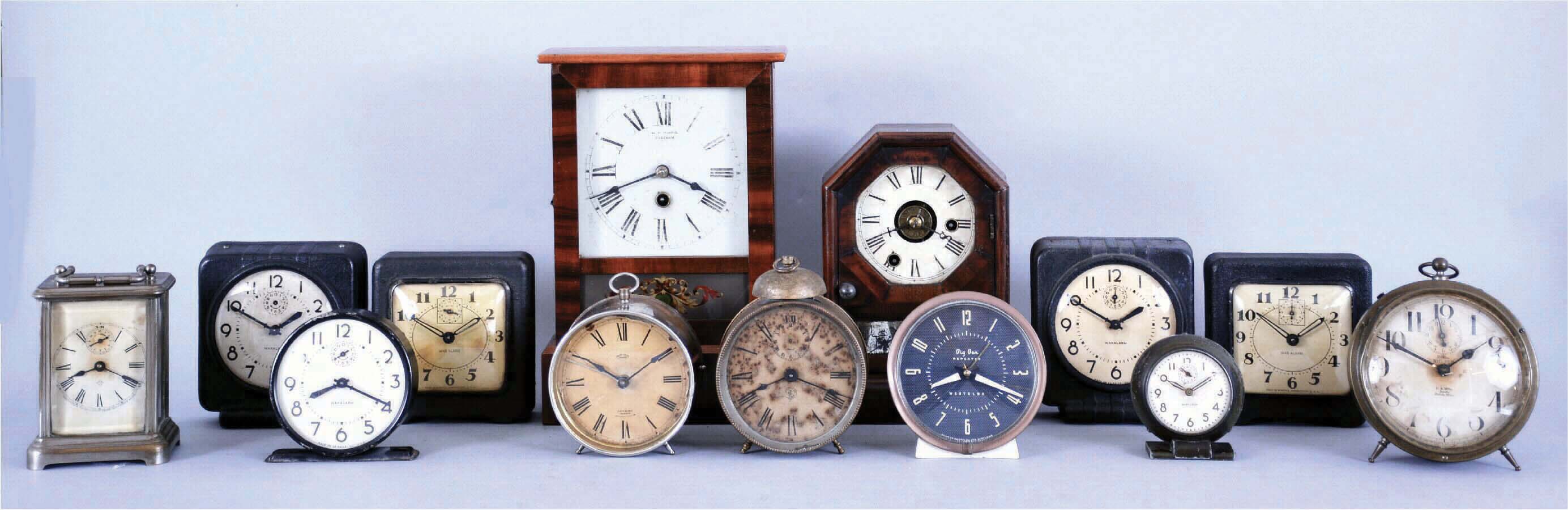 Clocks- 13 (Thirteen) American: two 19th century cottage models, plus later alarm clocks and desk timepieces. Alarms include 6 from WWII, "War Alarms" as printed on the dials, four of these are in square, hard molded paper mache cases with original black finish. 4 mixed nickel plated alarms (one in a carriage style case) and a mid century Westclox Big Ben. — Antique Clocks Price Guide