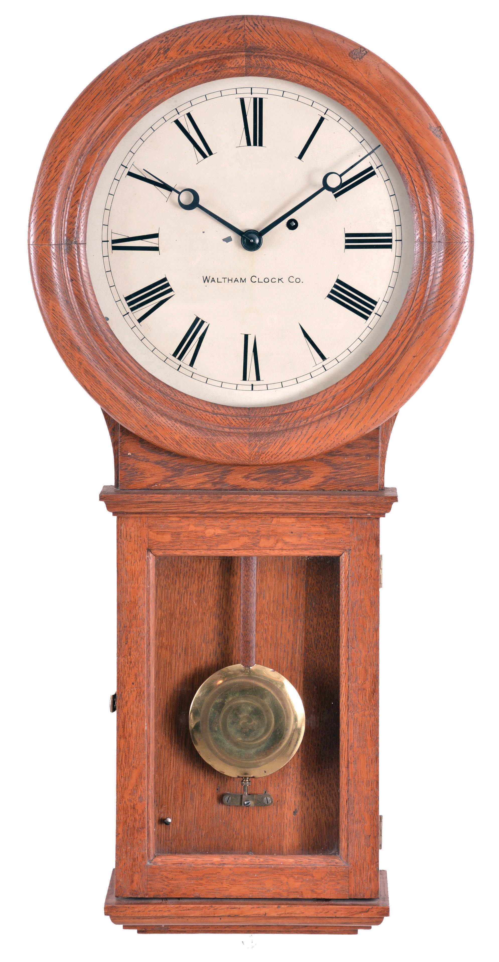 Waltham Clock Co., Waltham, Mass., "Regulator No. 34", in an oak case, the turned and glazed bezel opens to the painted zinc roman numeral dial signed, "Waltham Clock Co.", the mid section cornice surmounting the glazed lower door for pendulum, tie-down and weight access, eight day, brass movement with plate marked "Waltham Clock Company/USA" and damascened decorated, dead-beat escapement, maintaining power, lead weight, wooden pendulum rod and brass-faced bob. — Antique Clocks Price Guide