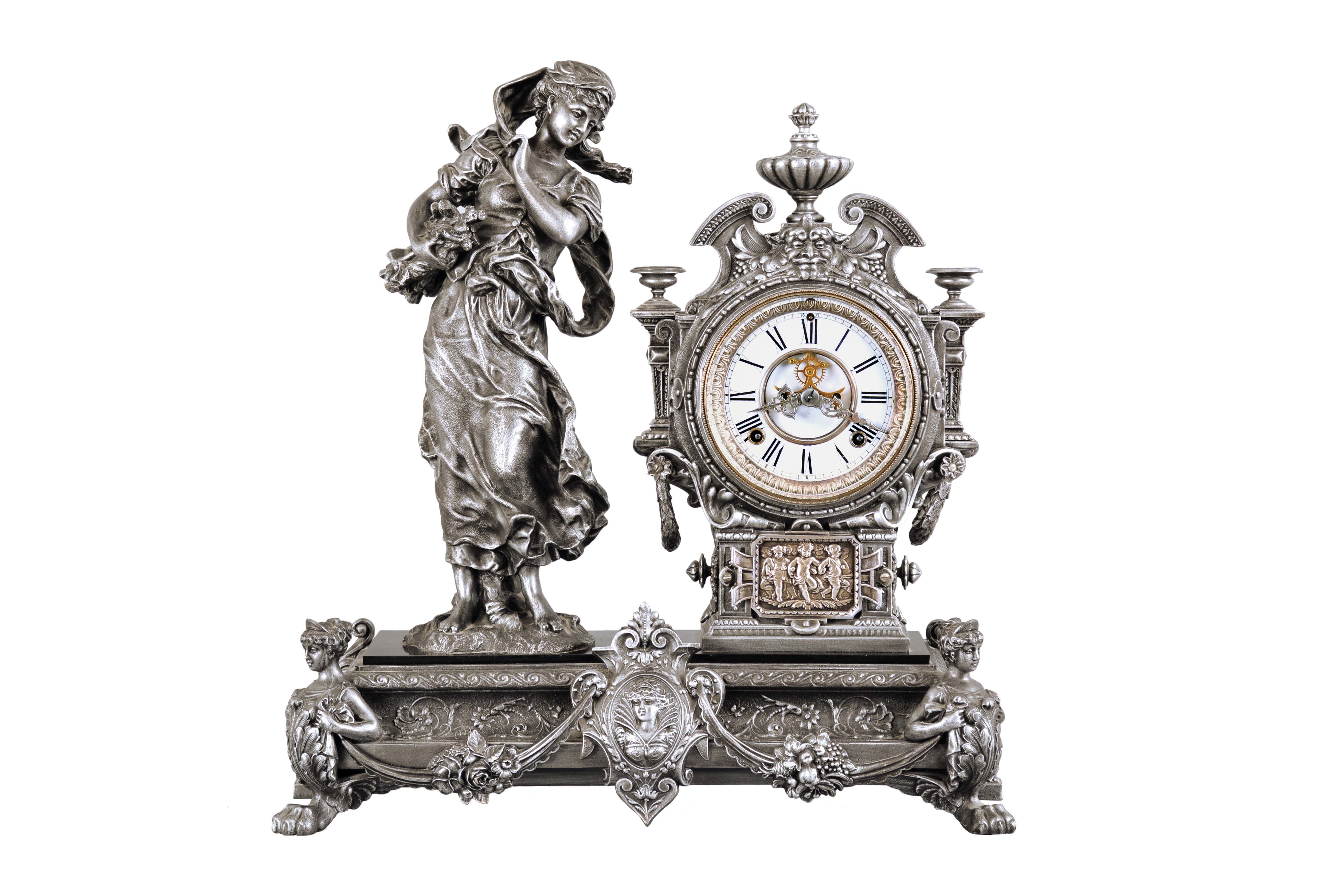 Ansonia Clock Co., New York, "Winter", 8 day, time and strike metal case figural mantel clock. — Antique Clocks Price Guide