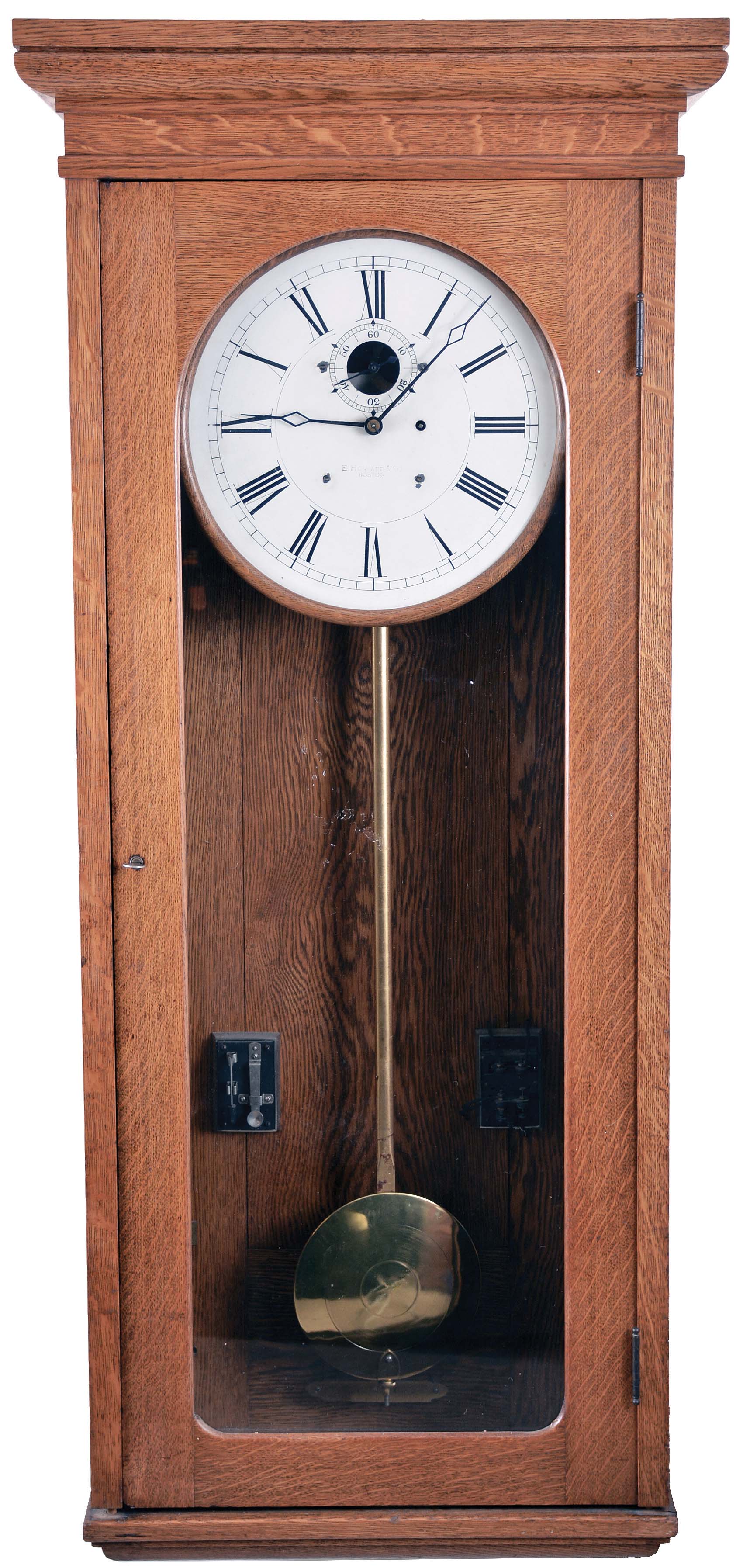 E. Howard & Co., Boston, Mass., "Program Clock", wall clock, 8 day, time only, weight driven movement in an oak case with attached electrical components to operate a system of bells, buzzers or whistle blowing devices and a painted metal dial — Antique Clocks Price Guide