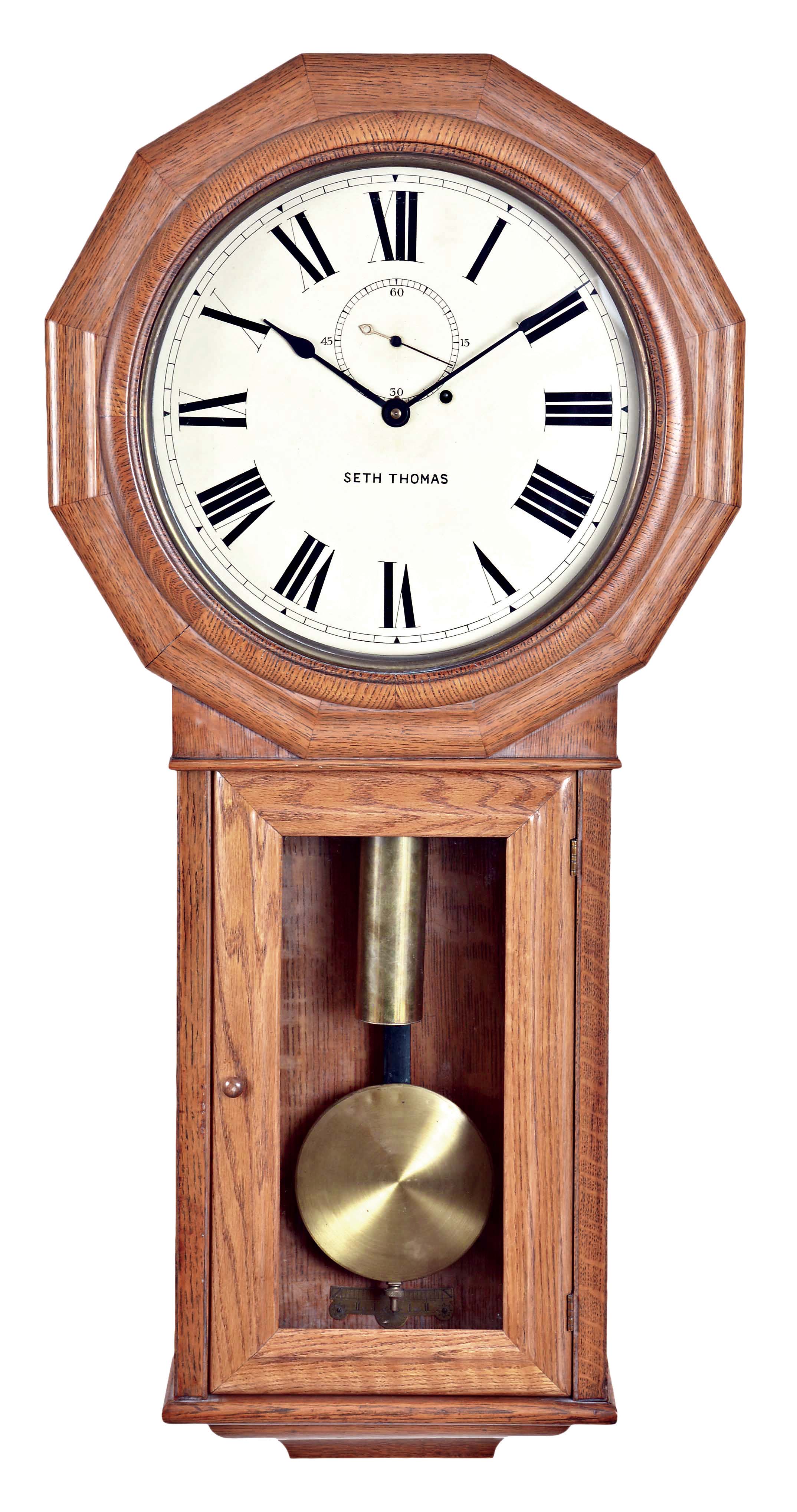 Seth Thomas Clock Co., Thomaston, Conn., "Regulator No. 3" wall clock, the oak case with octagonal head and turned wooden glazed bezel over the 13-inch painted zinc roman numeral dial with seconds bit and signed "Seth Thomas", glazed lower door for pendulum and weight access, all on a molded pedestal, eight day brass timepiece with trapezoidal plates stamped "ST (logo) /Made in U.S. America", quality dead-beat escapement with beat setting adjustment, maintaining power, and rear hung pendulum on iron movement support bracket. — Antique Clocks Price Guide