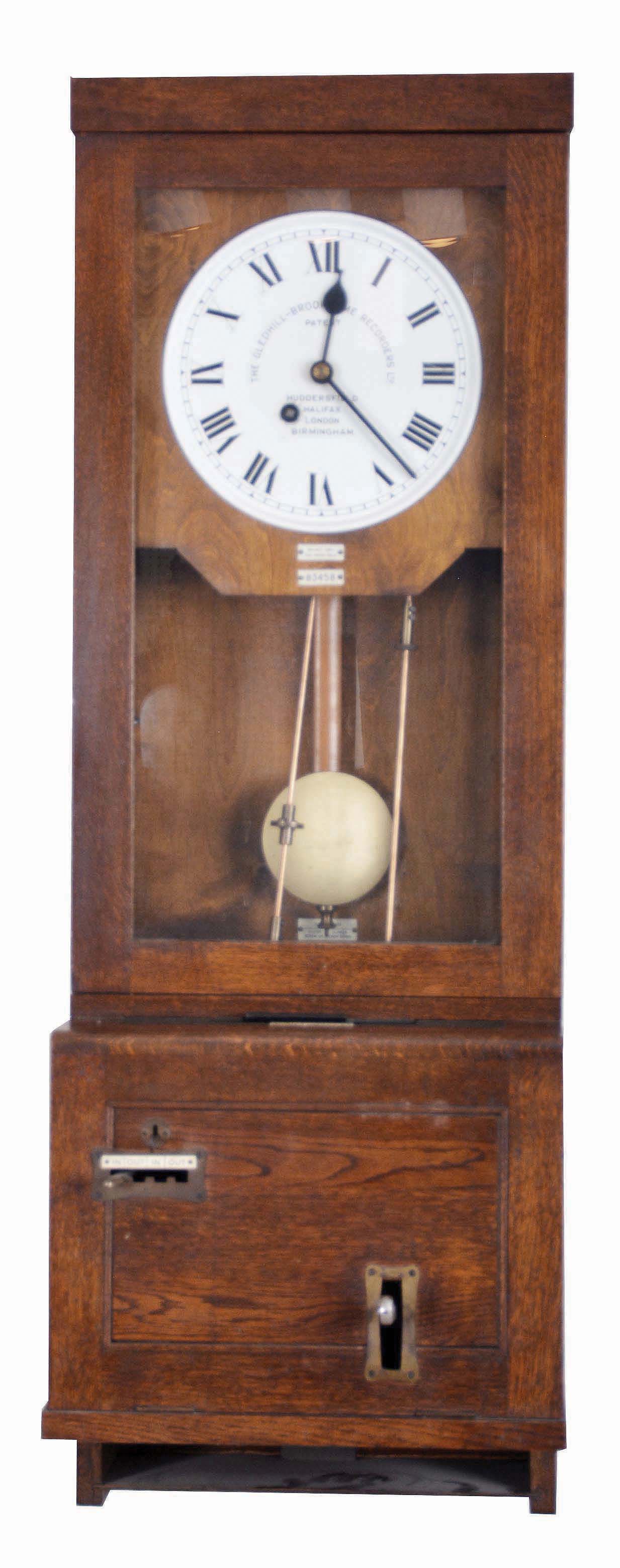 The Gledhill-Brook Time Recorders Ltd., Huddersfield Halifax, London, Birmingham, time recorder punch wall clock, 8 day, time only, spring driven movement in an oak case with painted metal dial including punch card holder — Antique Clocks Price Guide