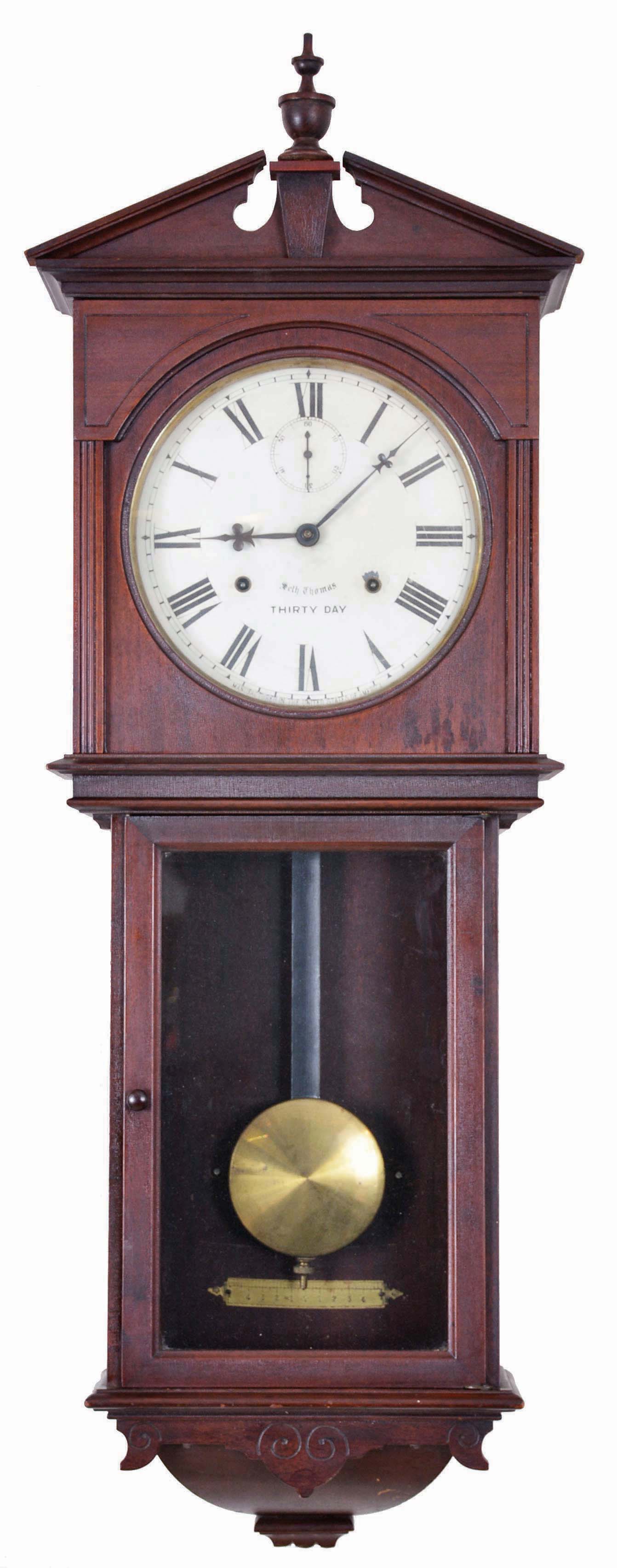 Seth Thomas Clock Co., Thomaston, Conn., "Umbria", wall clock, 30 day, time only, double spring driven 86W movement in a mahogany case with a painted metal dial — Antique Clocks Price Guide
