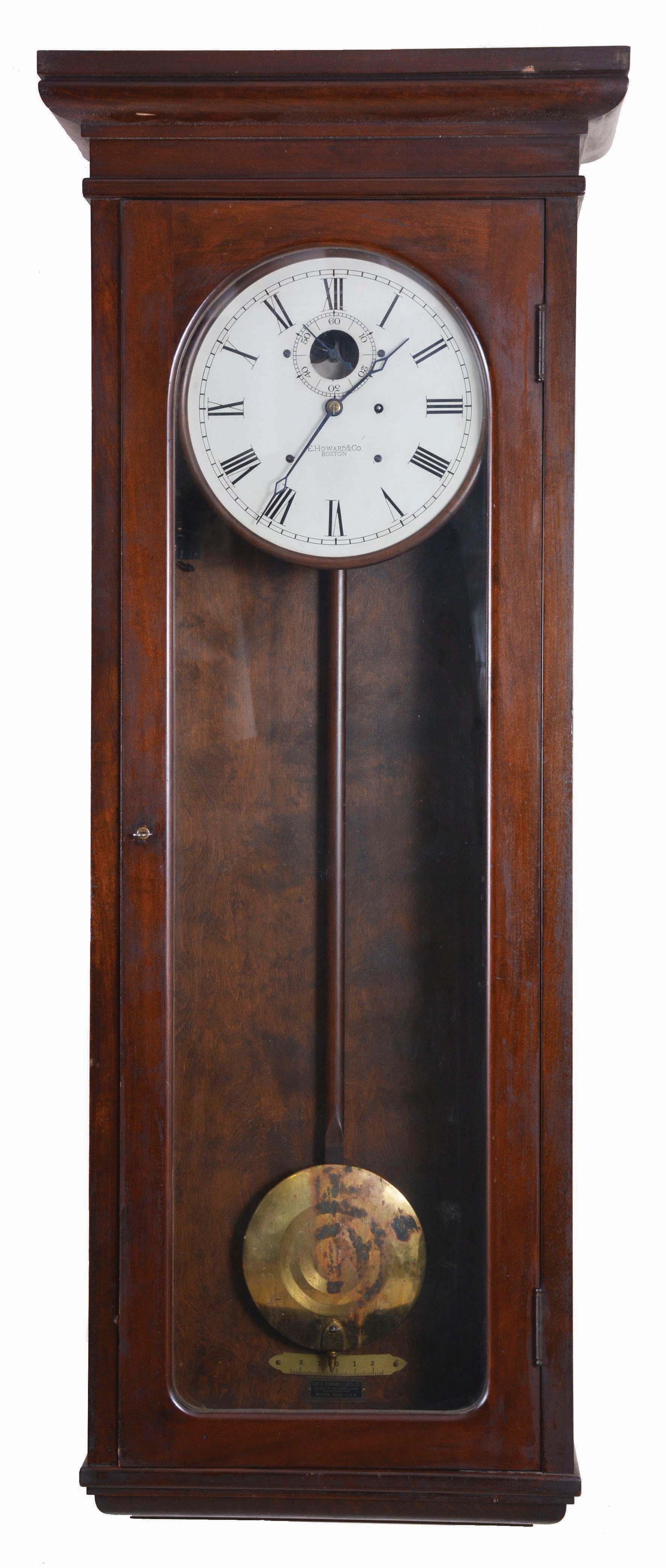 E. Howard & Co., Boston, Mass., "Regulator No. 89", jeweler's regulator wall clock, 8 day, time only, weight driven movement with Graham deadbeat escapement sending electrical impulse to slaves in a mahogany case with a 12in painted metal dial — Antique Clocks Price Guide