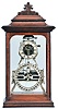 American, Ithaca Calendar Clock Co., "Box Skeleton" double dial perpetual calendar, with nickelled, skeletonized frame, and contained in a glazed, walnut case with ebonized moldings, from the collection of Dr. Hugh Grant Rowell at Dartmouth College.