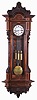 European, 3-weight "Vienna Regulator", grande sonnerie in a large 72 beat version, the modern walnut case carefully copied from an original, with canted corners, dozens of small frame moldings accenting burled insets, and carved with lions heads and roses at top, and acanthus leaves near bottom of door. The base itself fully carved with winged eagles and leafy scrolls. Removable top trim with large carved lions head and floral accents.