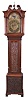 Benson, Whitehaven, England, tall case clock, 8 day, time and bell strike, weight driven movement in a carved oak case with broken arch top, center brass finial, full turned columns flanking hood resting on ogee feet. The engraved brass dial has applied spandrels and calendar off center