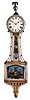 Bench-made Patent timepiece or "Banjo" Clock, with mahogany case, brass bezel opens to the roman numeral dial surmounted by a ball and eagle finial, gilded rope molded frames for the reverse-painted glasses, the lower depicting and inscribed "Hull" with central shield and eagle pendulum aperture, the waist glass with similar patriotic depiction of a Federal shield and eagle amidst decorative scroll work in gold, red, green and white, the whole resting on a carved and gilded pedestal at the base with acorn drop, eight day time-only movement with recoil escapement, lead weight and pendulum bob and iron rod.