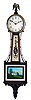 Waltham Watch Co., Waltham, Mass., Mahogany Banjo Clock, with pictoral glasses depicting Mt. Vernon and George Washington, the eagle finial caps the case over the Arabic numeral dial marked "Waltham", half round frames enclose the glasses, carved pedestal with acorn drop on the base, eight day time only brass movement inscribed "Waltham Watch Co." with dead beat escapement, maintaining power, Geneva stop, lead weight and pendulum.
