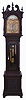 J.E. Caldwell, Philadelphia, (retailer) tall clock, 8 day, time, strike and chime on gong, three brass weight driven English movement with moon decorated pendulum in a Chippendale-style carved mahogany stained oak case with broken arch top and rope turned full columns flanking hood, three wooden finials, beveled glass on trunk door and rope turned quarter columns on trunk door and plinth. The brass dial has silvered chapter ring and center boss with engraving, chime silent selector, cast brass corner spandrels, moon phase and second's bit.