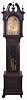 Germany, tall clock, 8 day, time, strike and chime on gongs, three brass weight driven movement in a mahogany case with beveled glass trunk door, broken arch top, paw feet, three wooden finials and applied moldings on base with brass dial, silvered chapter ring, applied brass spandrels, moon phase and seconds bit.