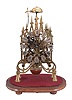 Martin and Gain, Madrid, Spain, 2-fusee skeleton clock, the multi spired Gothic frame of brass is well fretted and polished. This firm launched in Spain to try to meet the resurging interest in skeleton clocks and a general shortage in old merchandise in the 1970's Fusees are with cable rather than chain. Wheels are simple 4-spoke design. Strikes the hours and halves on a central bell.