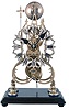 England, 3 spire Gothic frame, single fusee skeleton clock, with a silvered fretted dial, passing strike [single bell on the hour], no dome, mounted to a rectangular wooden base.