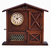 F. Kroeber Clock Co., New York, "Mountain Boy", 30 hour, time and alarm, spring driven brass movement in a walnut case resembling a cottage or barn with bisque figure of a boy urging the owner to rise.