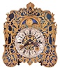 Austria, a small, complicated, grand sonnerie striking shelf or table clock, the blued steel dial plate with overlaid fretted, foliate engraved mask, Roman numeral, arcaded, engraved silvered dial with subsidiary day and date displays, and with engraved moon phase dial over 12:00, blued steel hands, 30- 60 hour grand sonnerie striking movement with verge escapement, time train with fusee and strike springs contained in fixed barrels, the balance with single turn spring, oscillating beneath a pierced, decorated bridge on the back plate