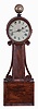 Massachusetts, 8 day, weight brass movement Patent or banjo timepiece with alarm and bell on top, in an Empire style case with mahogany veneered front and wooden side arms. Case is stamped "85".