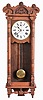 New Haven Clock Co., New Haven, Conn., "Elfrida" hanging clock with a spring driven 30 day timepiece movement in an oak case.