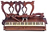 A. G. Marston, Campello, Massachusetts, 5 octave lyre-leg melodeon in a rosewood case. Also included is a second reed organ keyboard of roughly the same size and manufacture with a set of walnut legs.