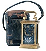 France, a miniature carriage timepiece with enamel panels and travel case, gilt case with carrying handle, the sides and back with polychrome enamel decorated copper panels, the dial with teal blue enamel ground, and decorated with polychrome birds and foliage, gilt Roman numeral chapter ring with fancy gilt hands, 8 day timepiece movement with lever platform, with original leather covered wooden travel case