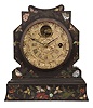 J. C. Brown, Bristol, Conn., shelf clock with a painted, gilt and MOP inlay decorated iron front case with a Noah pomeroy balance escapement movement with a fancy cast metal silvered dial, stamped with J. C. Brown signature.