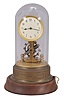 Germany, Eureka style, battery powered, electro-magnetic "skeleton" timepiece mounted on brass base with a large exposed rotating balance with dome.