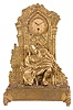 France, an unusual and amusing figural mantel clock, the gilt bronze case with rectangular base on owl form feet, supporting a Gothic ruin with fountain in a rustic landscape, the scene transformed at the observer's will by the placement of the removable, squatting female figure, taking a moment to relieve herself, case back with sheet brass enclosure now with Arabic numeral metal dial and 30 hour timepiece movement