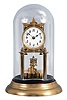 Germany, 400 day or anniversary clock, spring driven, torsion pendulum movement with disc pendulum in a polished brass case with cream porcelain dial under glass dome.