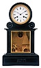 Reymond, Boult. des Italiens 36, Paris, a black slate mantel clock with automata, the stone case with rectangular, molded base, drumhead top, and mid section with gilt trimmed bevelled glass panel, before a gilt bronze blacksmith shop diorama, the forge at right, and with figure of cupid at his anvil, forging arrows, his hammer rising and falling as the clock strikes, signed Roman numeral white enamel dial, blued steel Breguet style hands, 8 day, time and strike pendule de Paris movement