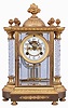 Waterbury Clock Co., Waterbury, Conn., "Orne" crystal regulator, 8 day, time and strike, spring driven movement with visible Brocot escapement in a gold plated case with two cut glass columns, white porcelain dial, and simulated mercury pendulum.