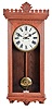 Waterbury Clock Co., Waterbury, Conn., "Regulator No. 18", wall clock, 8 day, time only, two weight driven movement in an oak case with a painted metal dial.