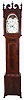 Jacob Guthart, Lebanon, Pennsylvania, tall case clock, 8 day, time, strike and calendar with four hands off of center arbor, weight driven movement in a mahogany veneer case with a broken arch top, three wooden finials, four turned full columns over cove molded and chamfered sides flanking crotch mahogany trunk door all resting on French feet. The painted metal dial has maker's signature, moon phase and sweep seconds.