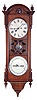 Seth Thomas Clock Co., Thomaston, Conn., "Office Calendar No. 10" (earlier version), 8 day, time and perpetual calendar, weight driven movement in a walnut case with fret work center, painted metal dials, and nickel, damascened pendulum bob.