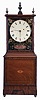 Aaron Willard, Boston, Massachusetts, dish dial mahogany shelf clock, reverse-painted glass with shields, stenciled flowers and lower cartouche inscribed "Aaron Willard/Boston" all over the iron roman numeral dish dial, the lower veneered wooden panel with line and central marquetry inlay resting on the flat veneered base and brass ball feet, eight day time only brass movement with pendulum and lead weight.