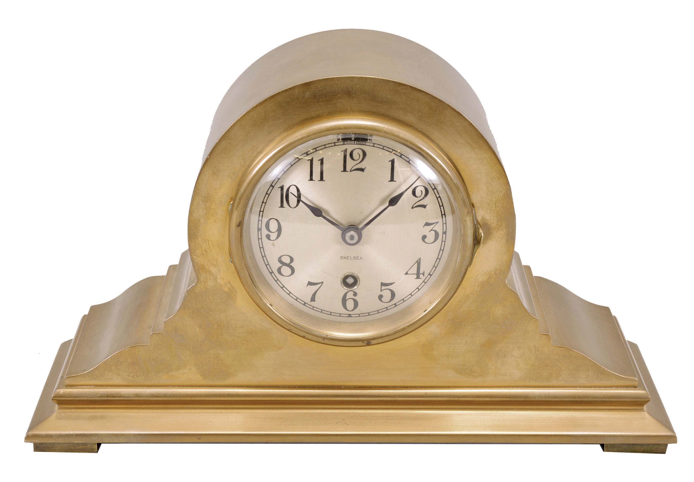 Chelsea Clock Co., Boston, "Tambour No. 15" mantel clock, 8 day, time only, spring-driven balance wheel movement in a tambour-form polished brass case, 4 inch signed silvered dial with Arabic numerals, and blued steel spade hands, movement serial number 214906. — Antique Clocks Price Guide