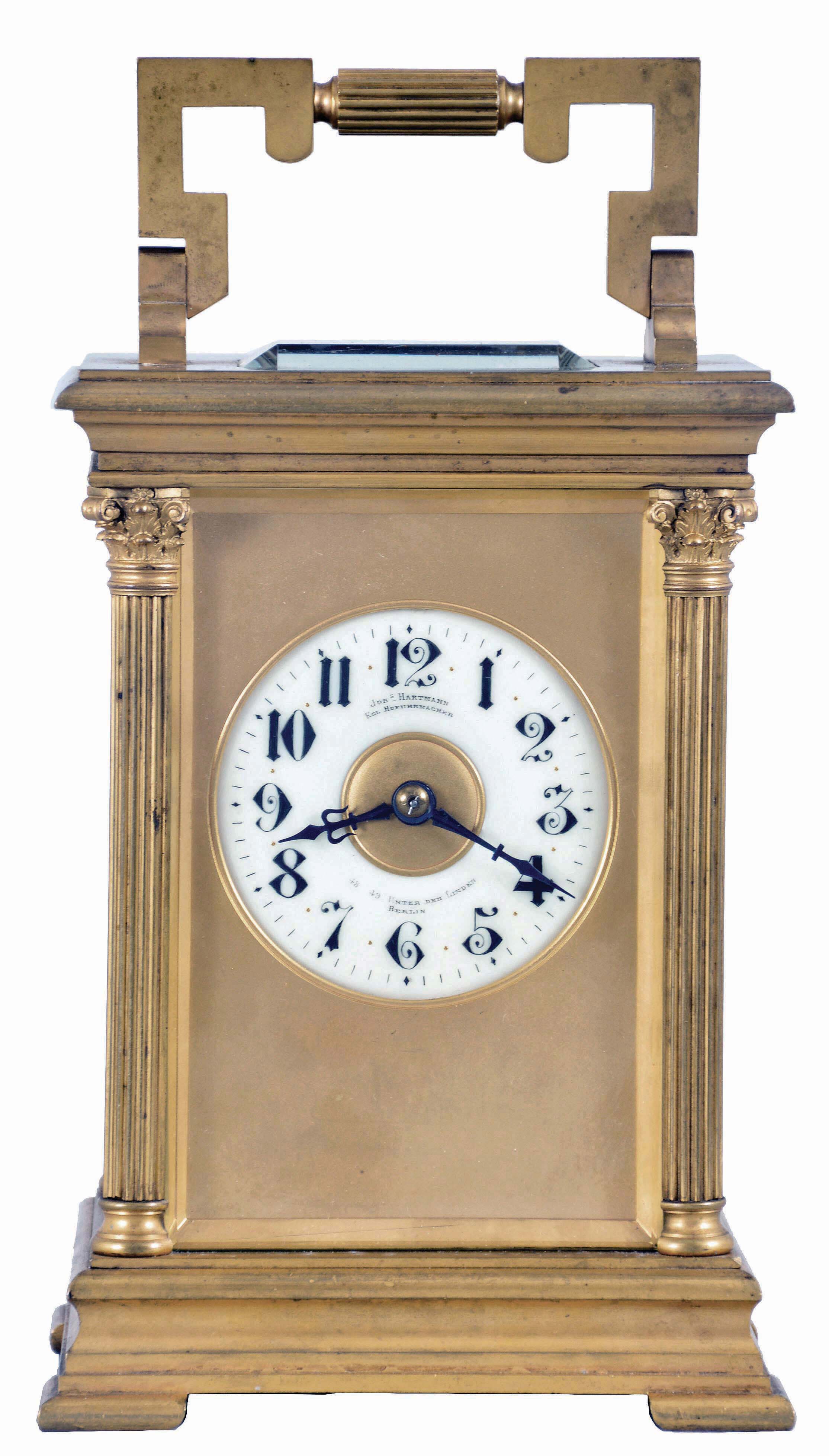 France, for Joseph Hartmann, Berlin, a giant carriage clock, gilt Anglaise Riche variant case with beveled glasses, Arabic numeral white enamel dial with gilt mask, blued steel hands, 8 day, time and strike movement with lever platform, cut bimetallic balance with gold timing screws, and counting the hours on a gong — Antique Clocks Price Guide
