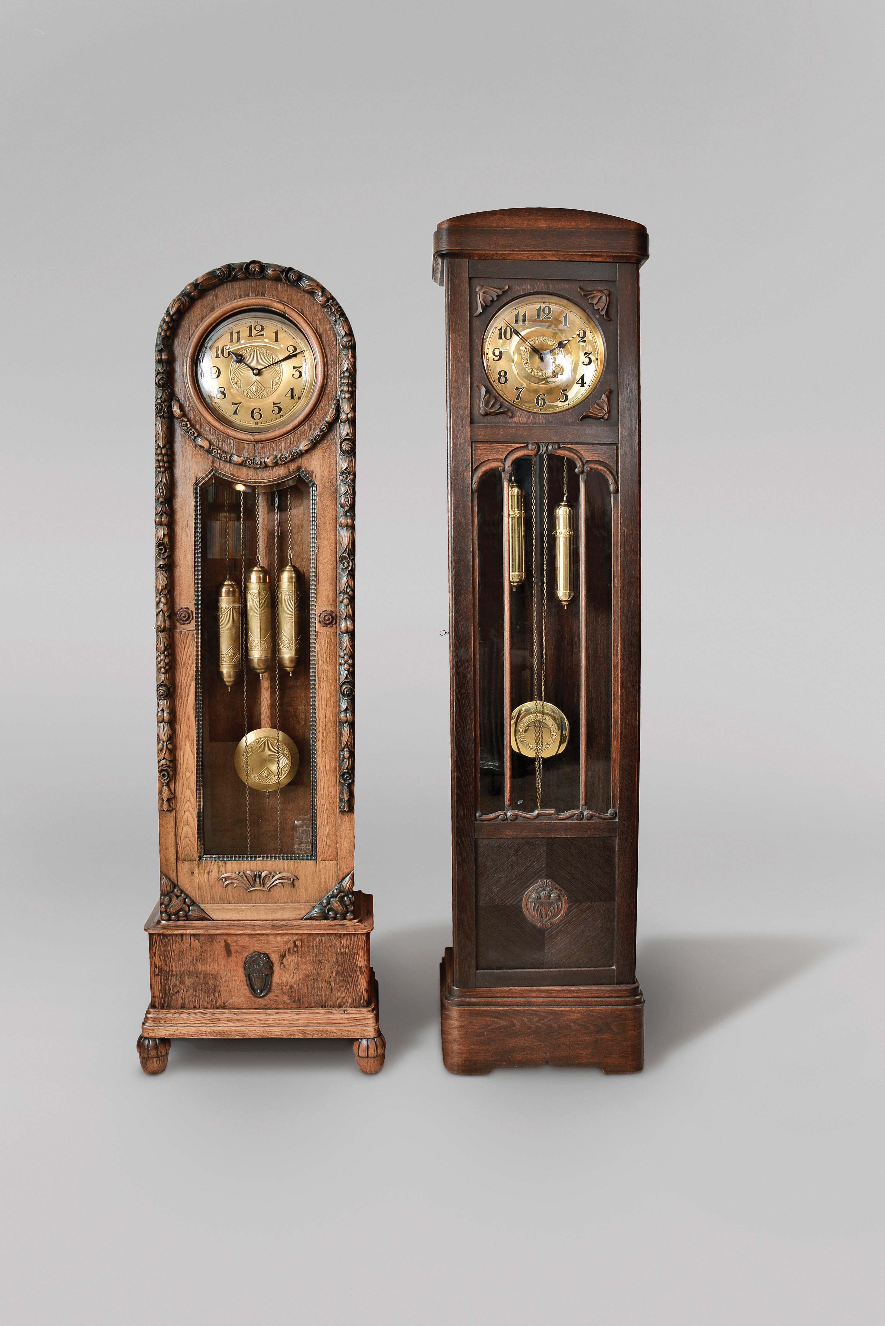 Tall Clocks- 3 (Three) Germany, 8 day, time and strike, weight driven movements in oak and glass cases, all with matching weights, pendulum and dial center: (1) quarter hour chiming; (2) time and strike only (3) time and strike only — Antique Clocks Price Guide